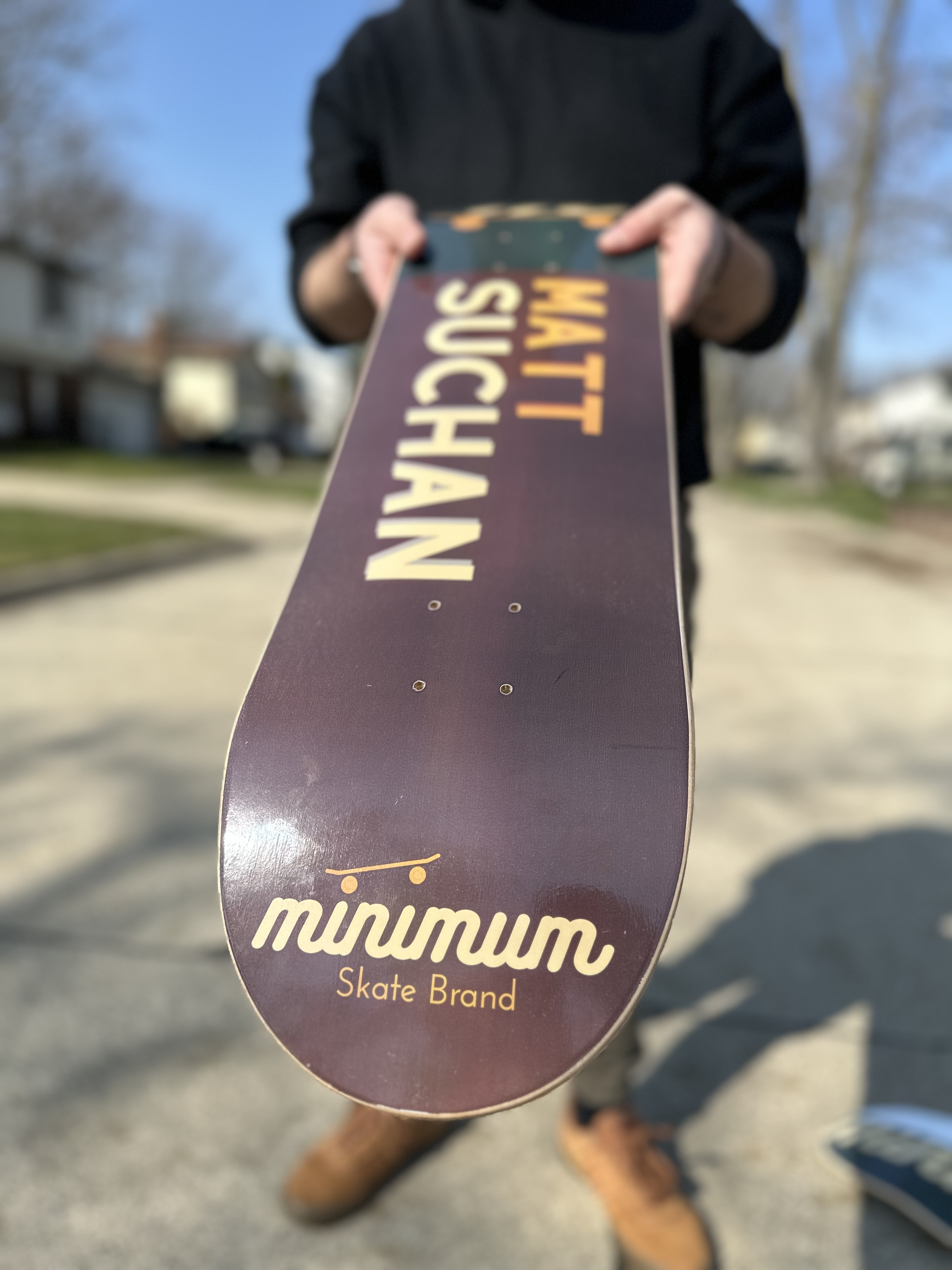 Namesake Skateboard deck showing minimum skate brand logo